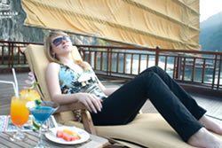 Relax on sun deck Valentine Cruises Halong Bay